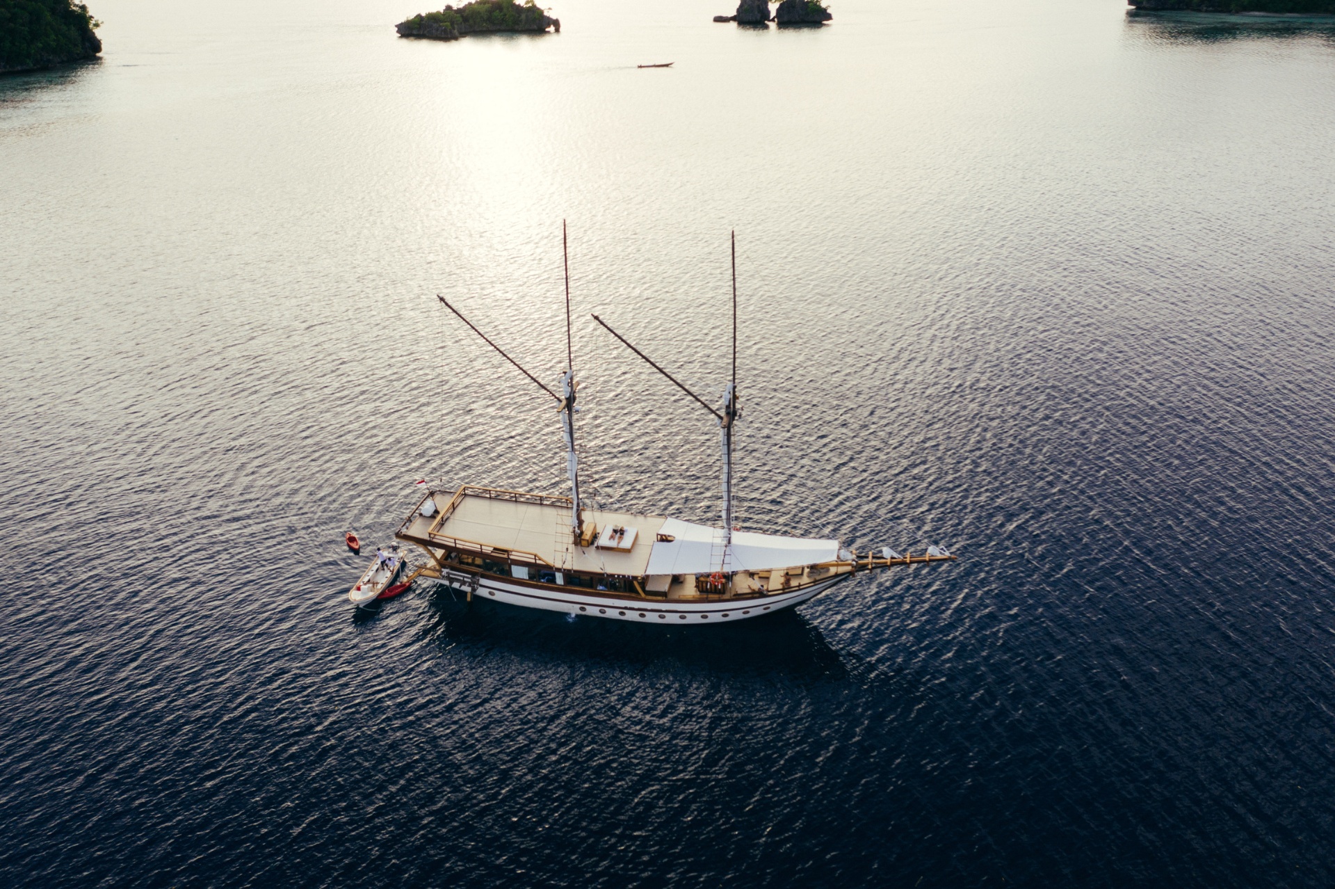 Senja seen from above cruising through Raja Ampat's karst islands at golden hour