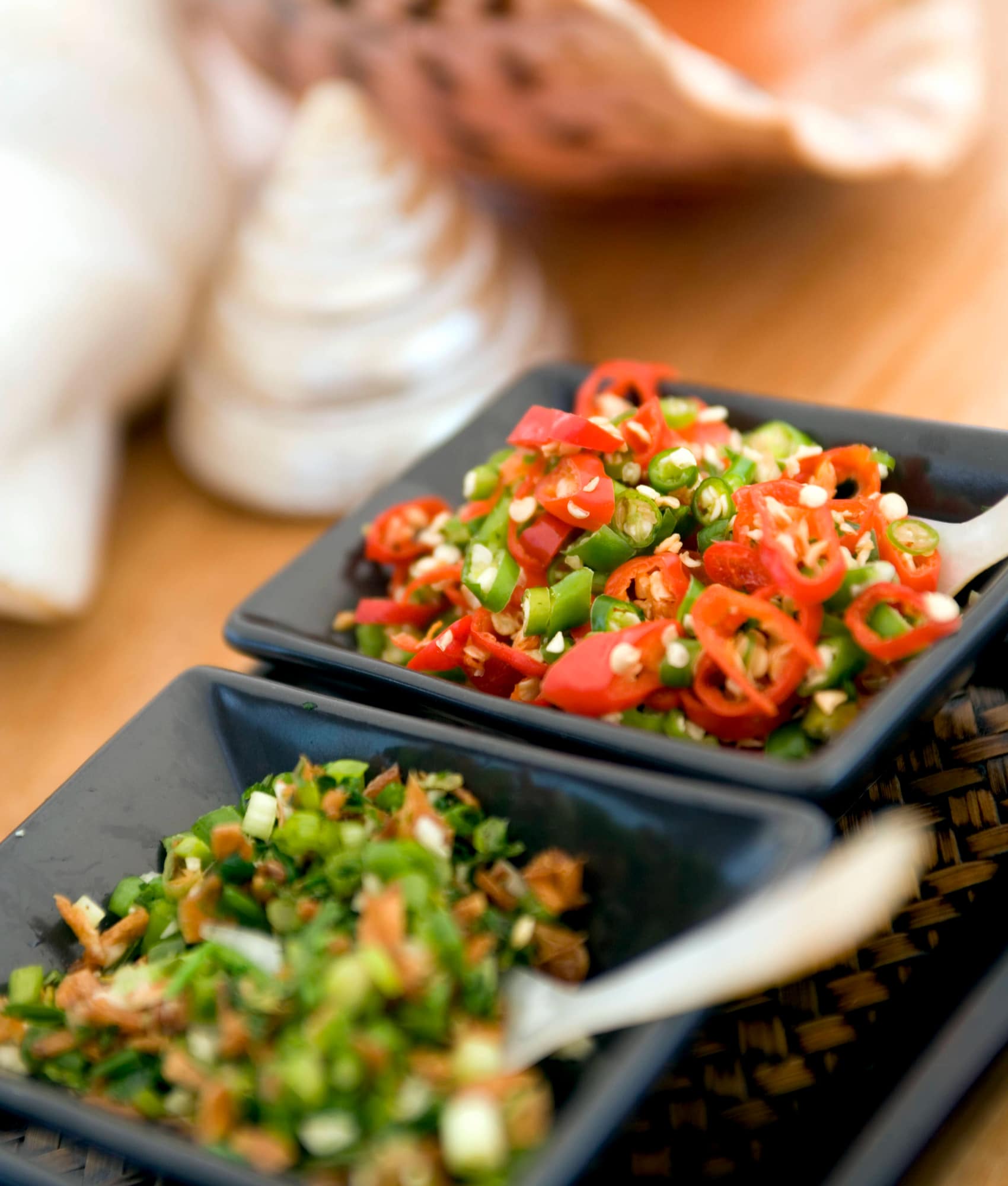 Sambal condiments — sliced red and green chillies with fried shallots — on Silolona's table