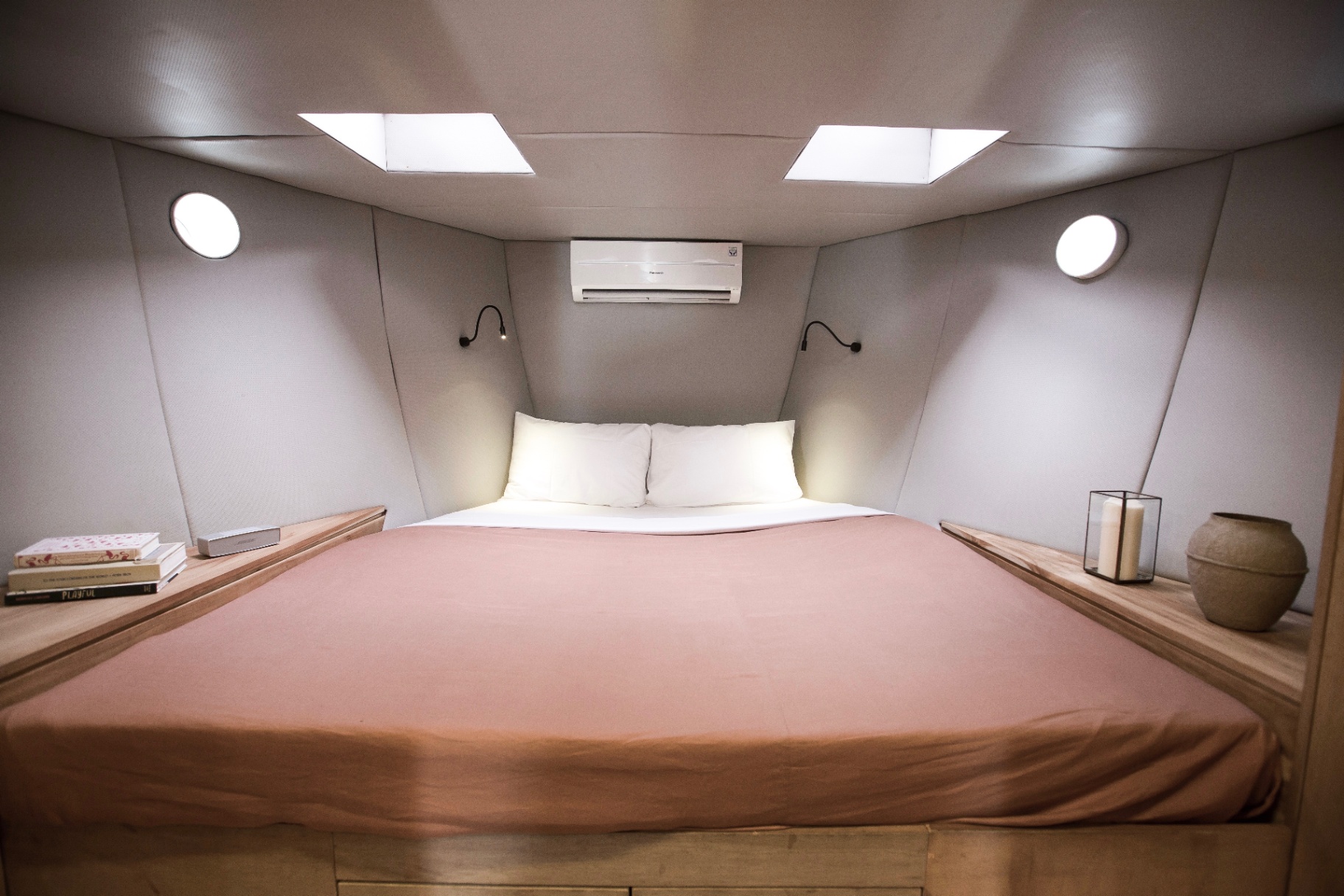 Splendour master-style cabin with oversized bed, skylights, reading lamps, portholes and air-conditioning