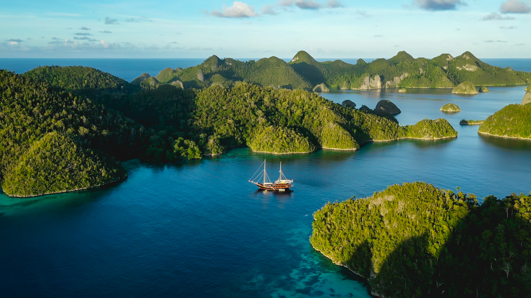 Dunia Baru anchored among the karst islands of Raja Ampat