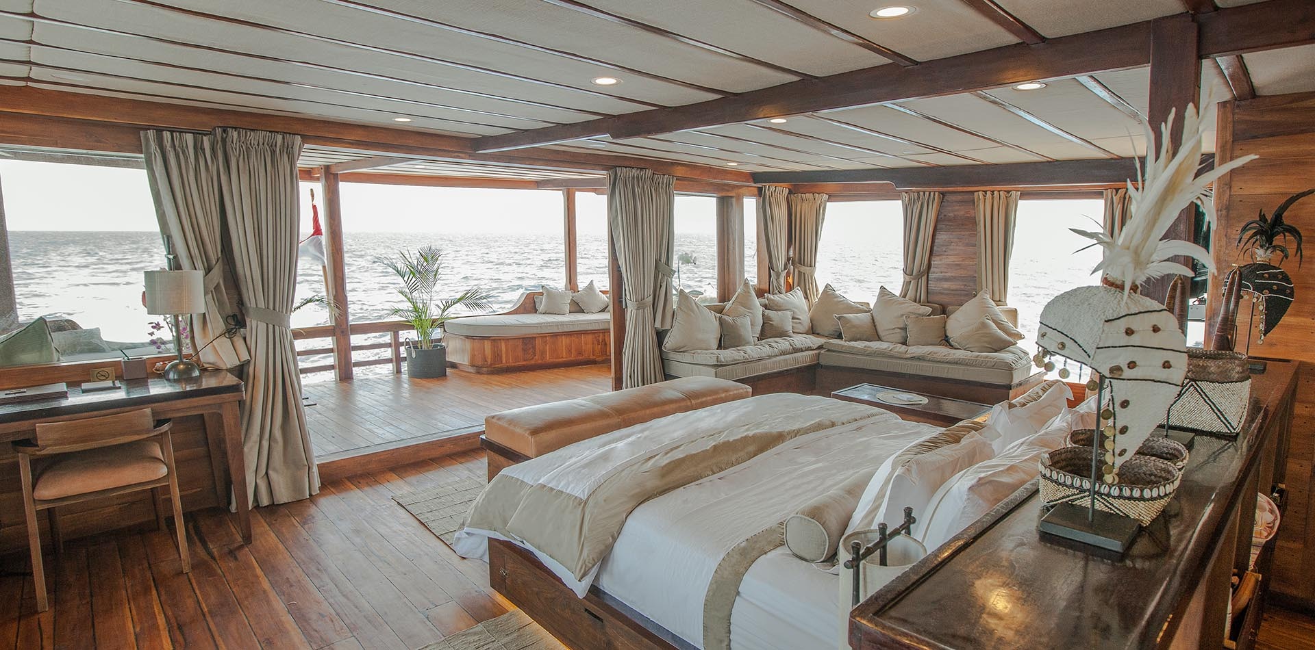 Prana by Atzaró suite opening onto a wraparound sea-view lounge