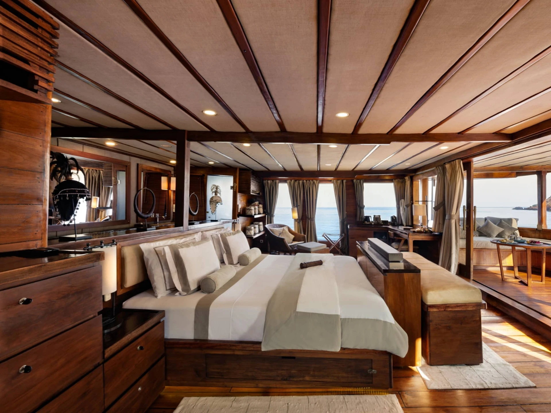 Prana by Atzaró master suite with king bed, teak interiors and panoramic ocean views