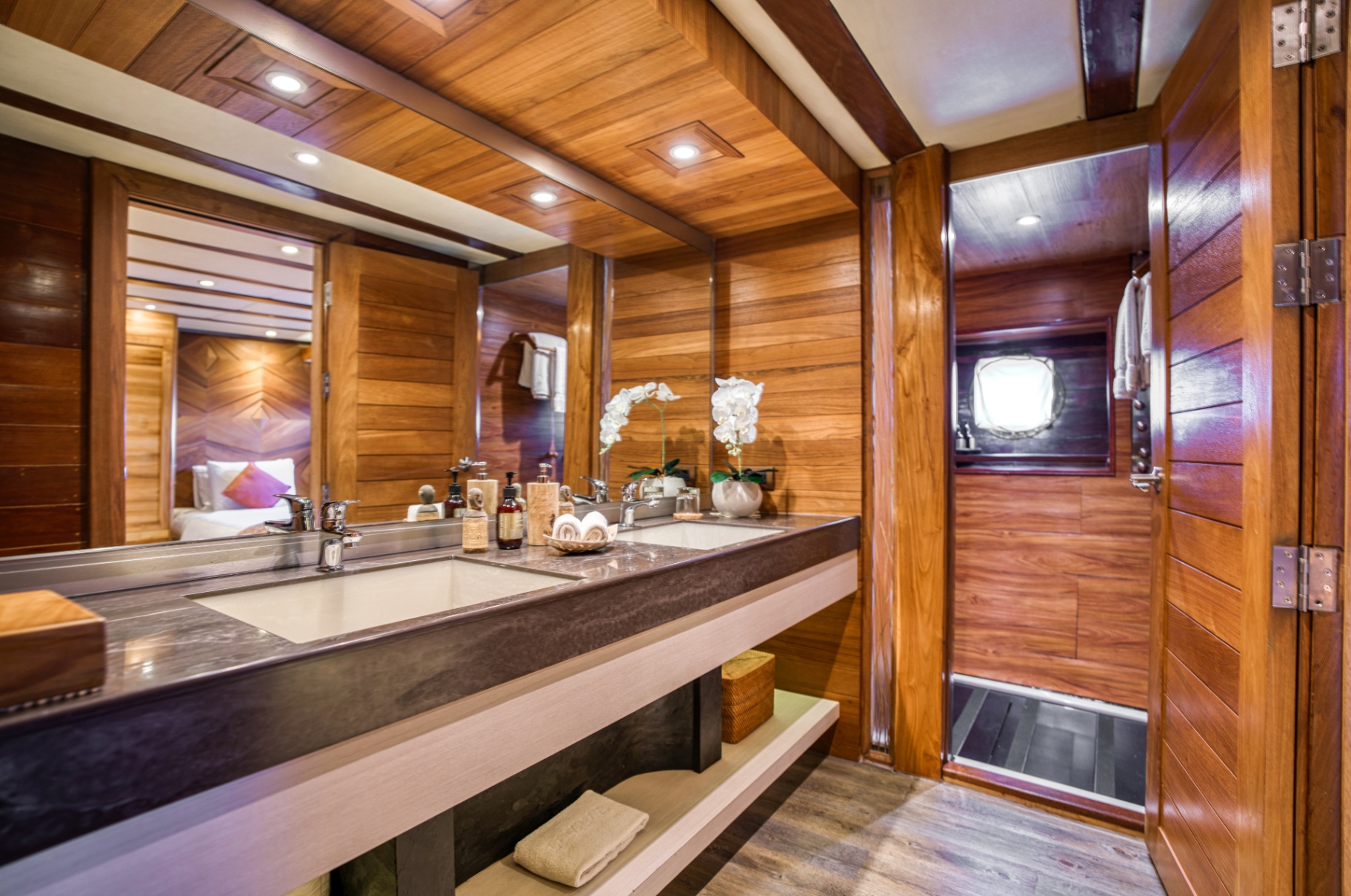 Ensuite bathroom on Lamima with dual sinks, stone counter and separate shower stall