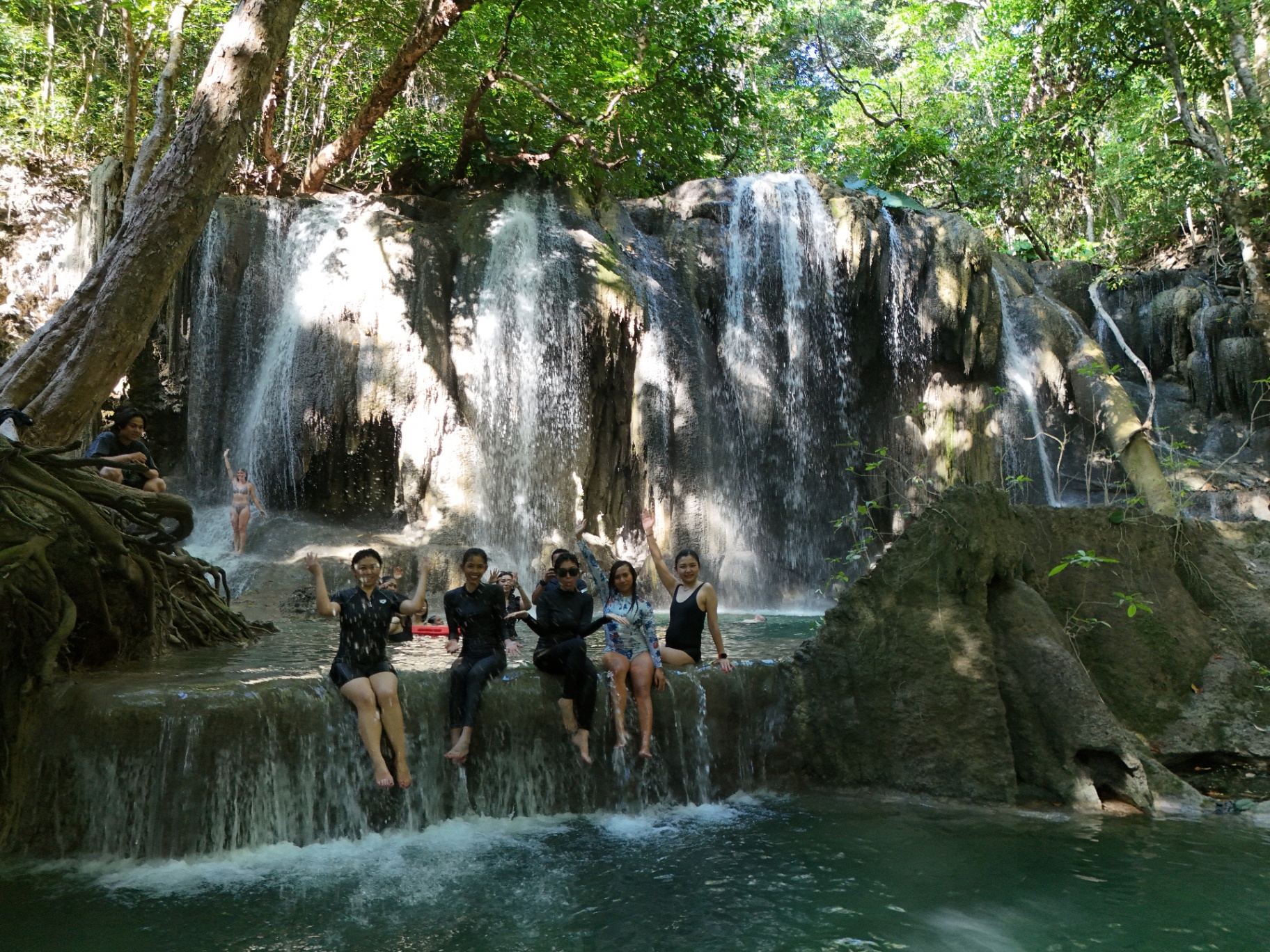 Guests from Sanctuary at a jungle waterfall on a Raja Ampat shore excursion