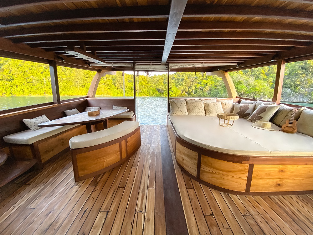 Private master terrace on Senja with daybed, dining bench and open views to Raja Ampat