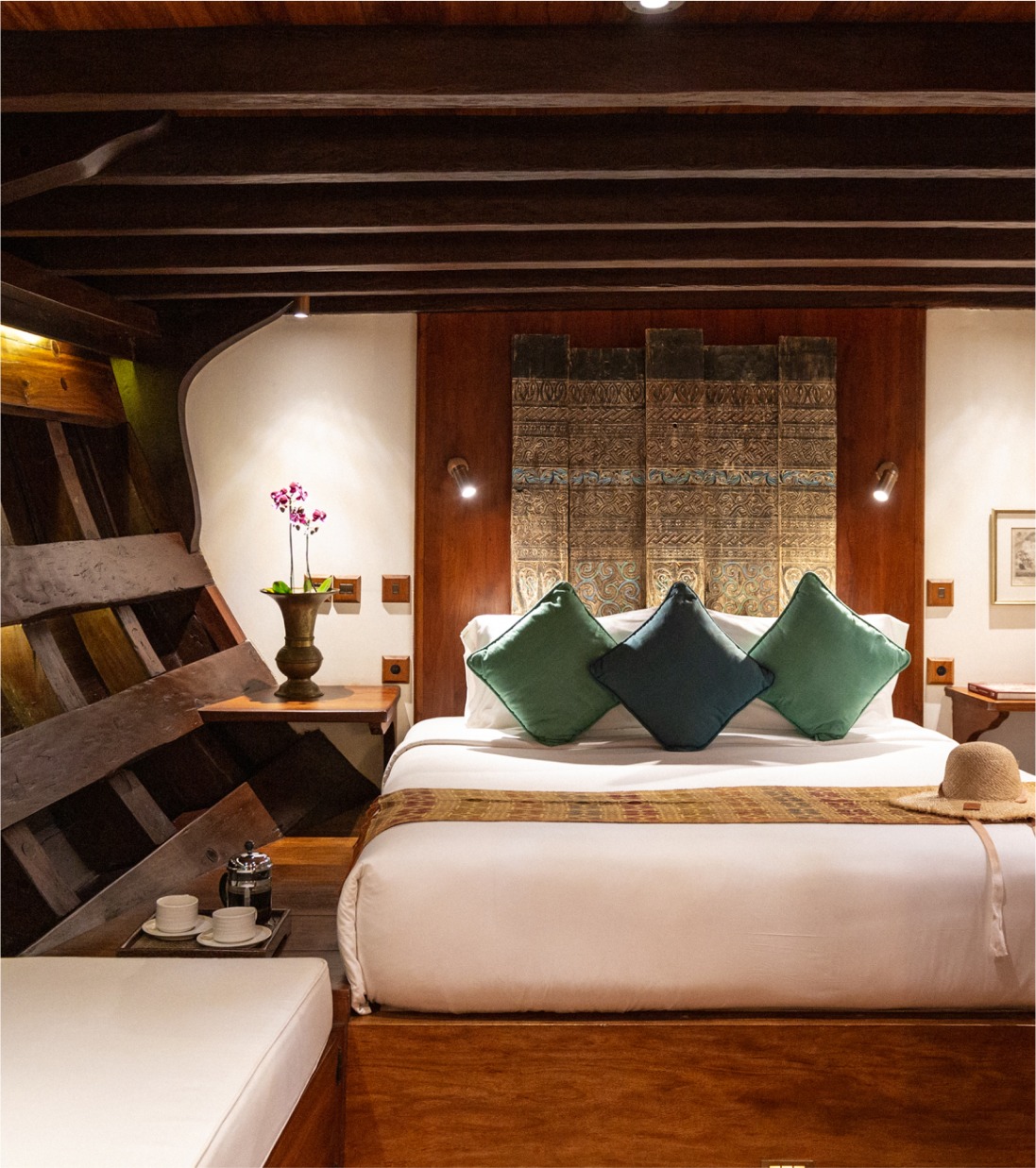 Guest suite on Si Datu Bua with king bed and antique carved timber headboard