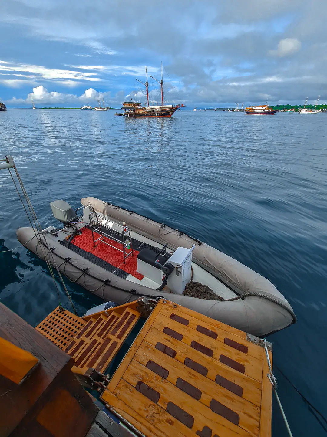 Anne Bonny's tender at the dive platform with the yacht anchored behind