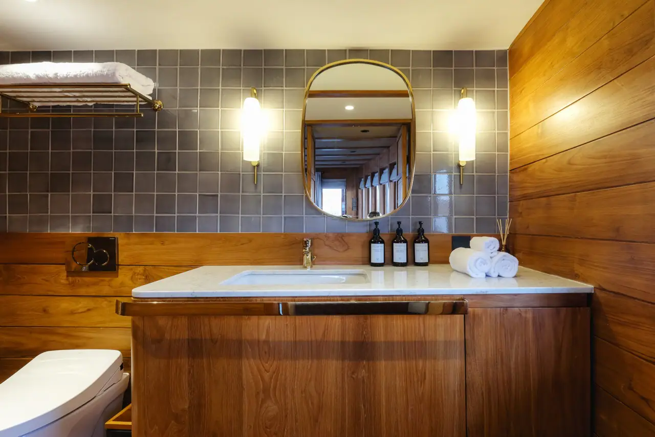 Celestia master stateroom ensuite bathroom with marble vanity and brass fittings