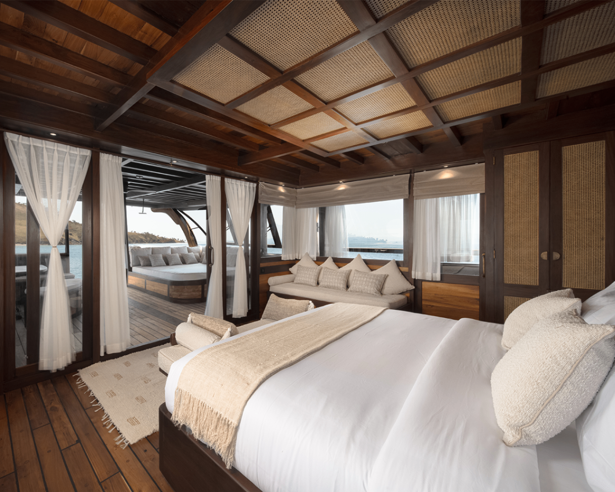 Sanya master suite with king bed, daybed lounge and private aft deck outside
