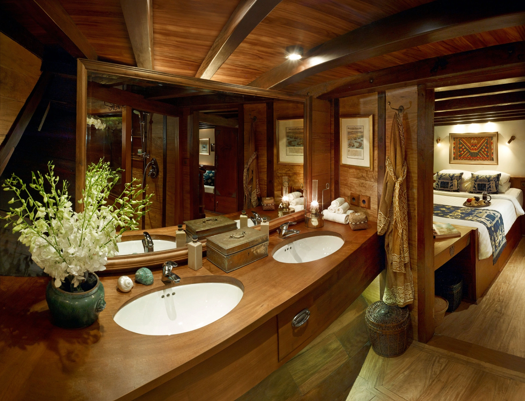 Master en-suite bathroom on Si Datu Bua with twin timber vanity, orchids and adjacent cabin view