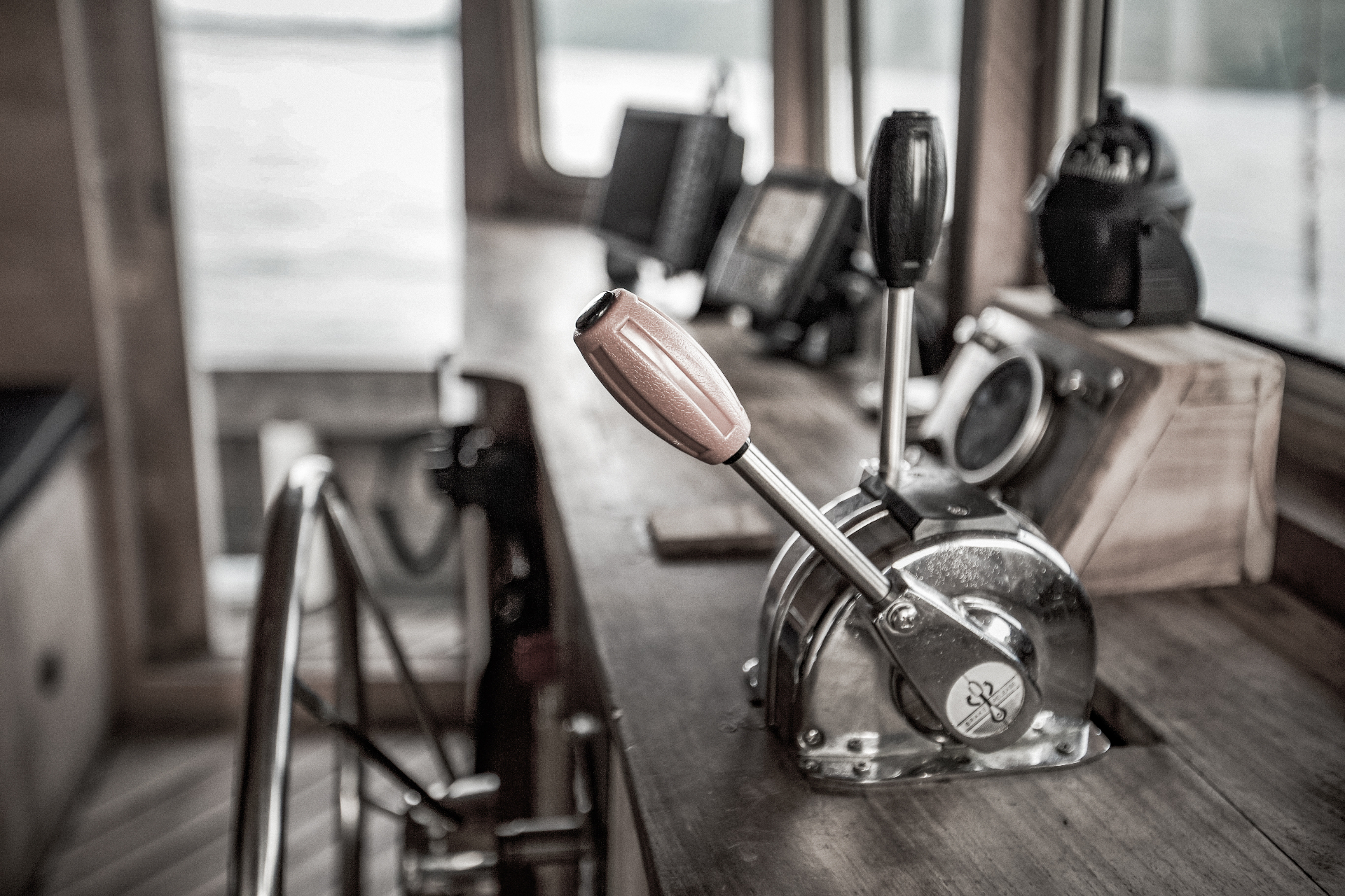 Splendour wheelhouse detail with polished throttle levers, ship's wheel and navigation instruments