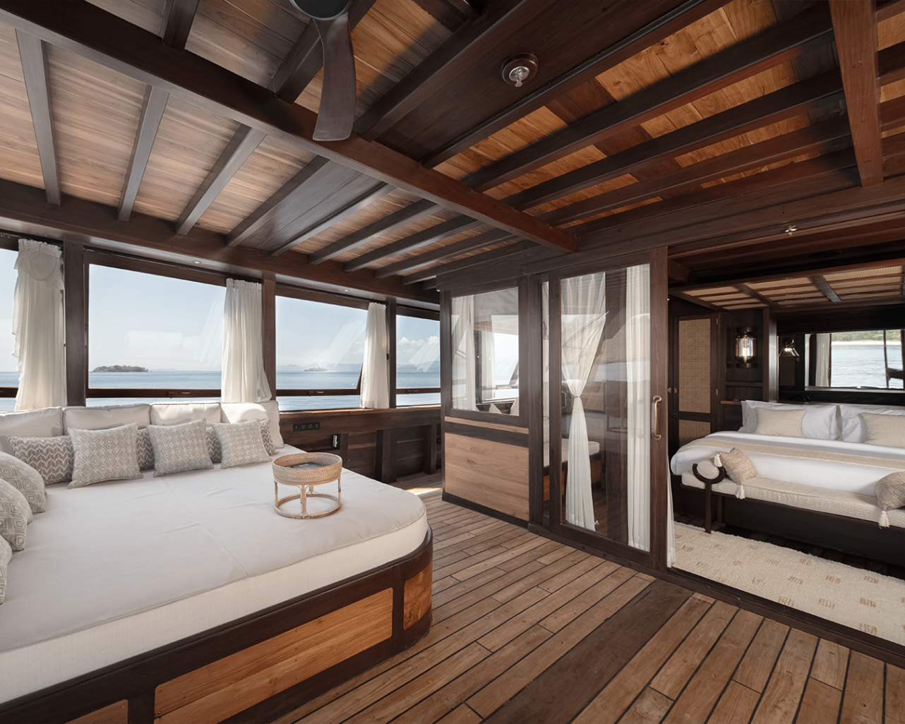 Master suite lounge on Sanya opening onto a private deck with sea views