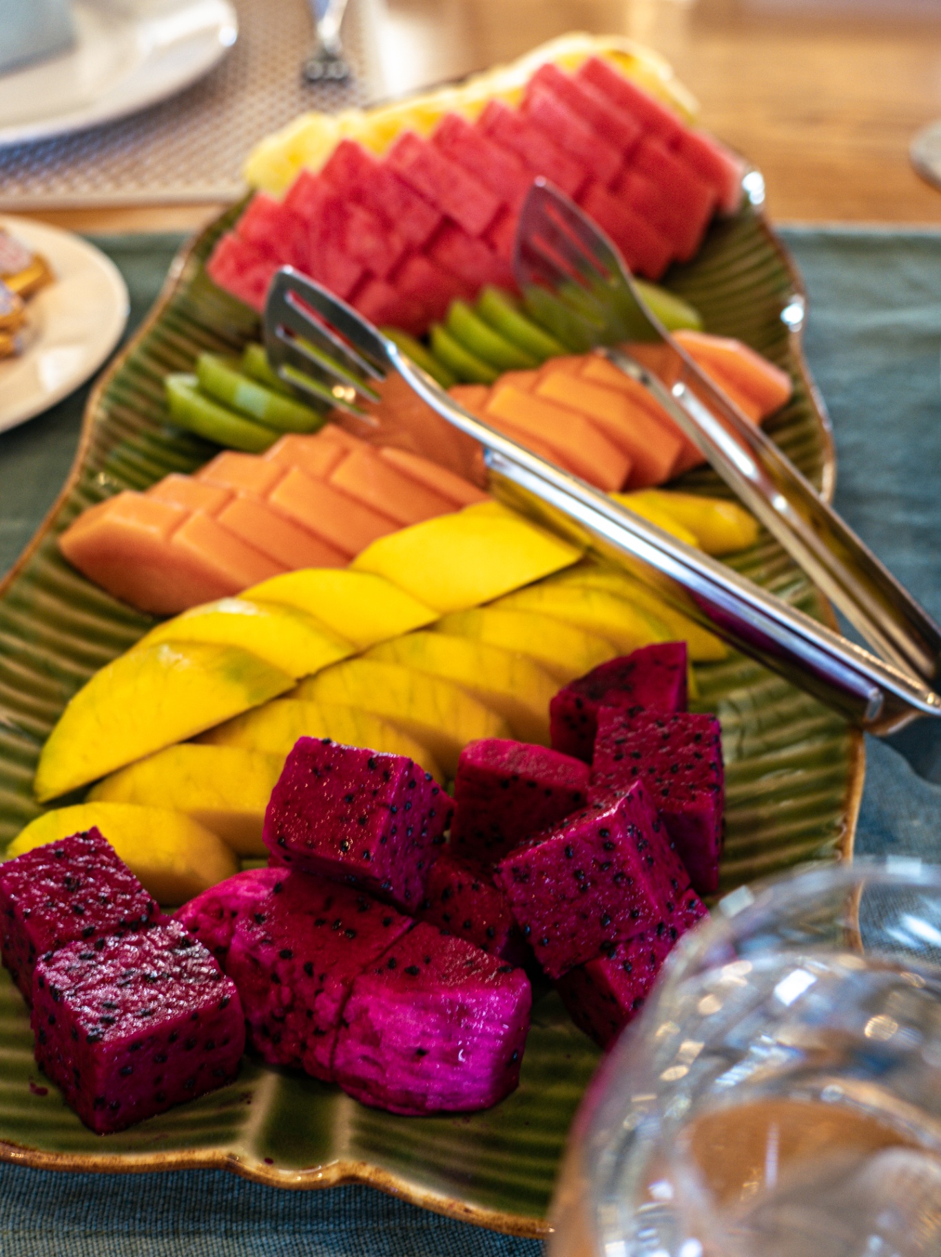 Tropical fruit platter with watermelon, papaya, mango and dragon fruit on Lamima's breakfast table