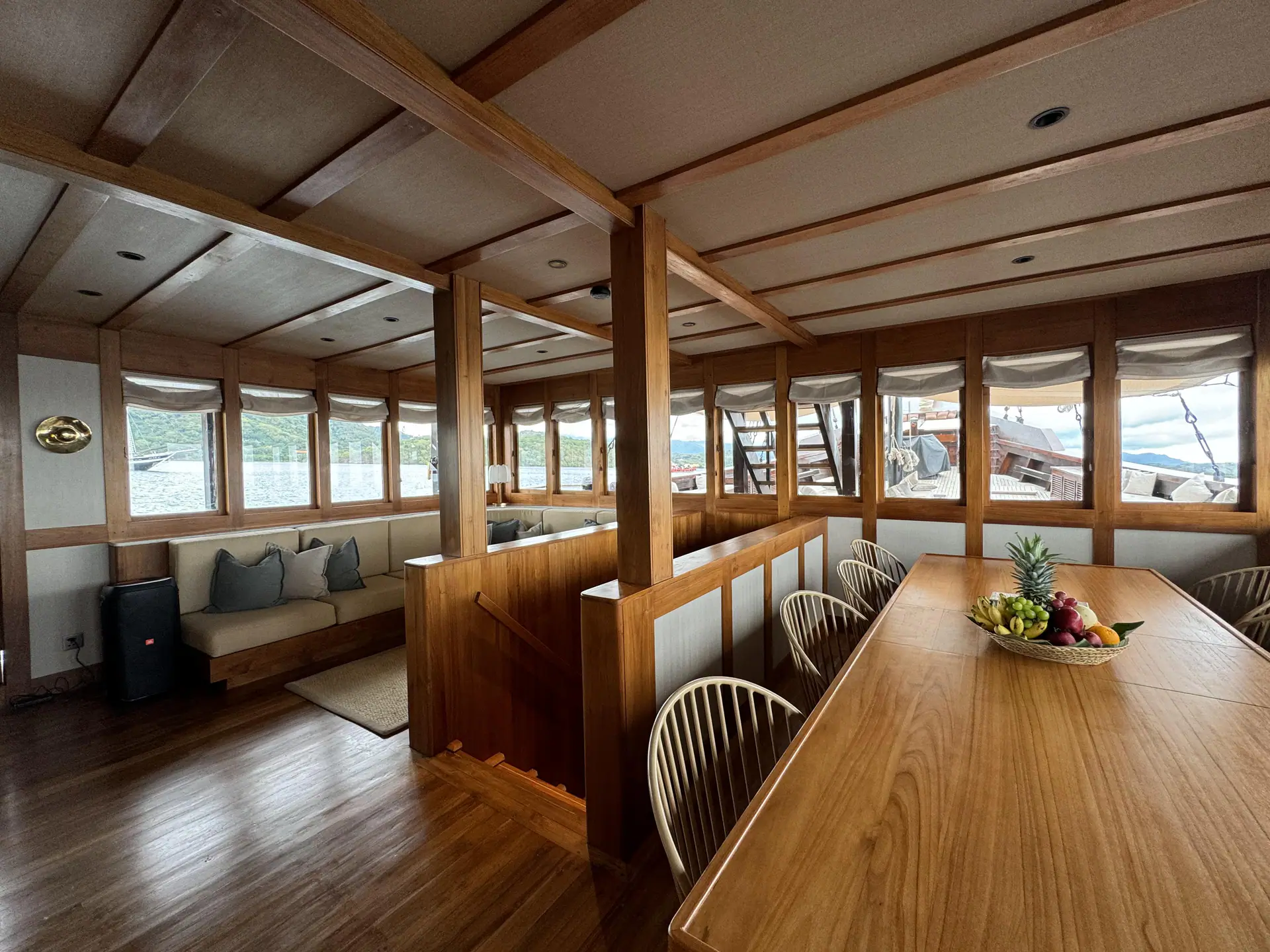 Celestia formal dining area with long teak table