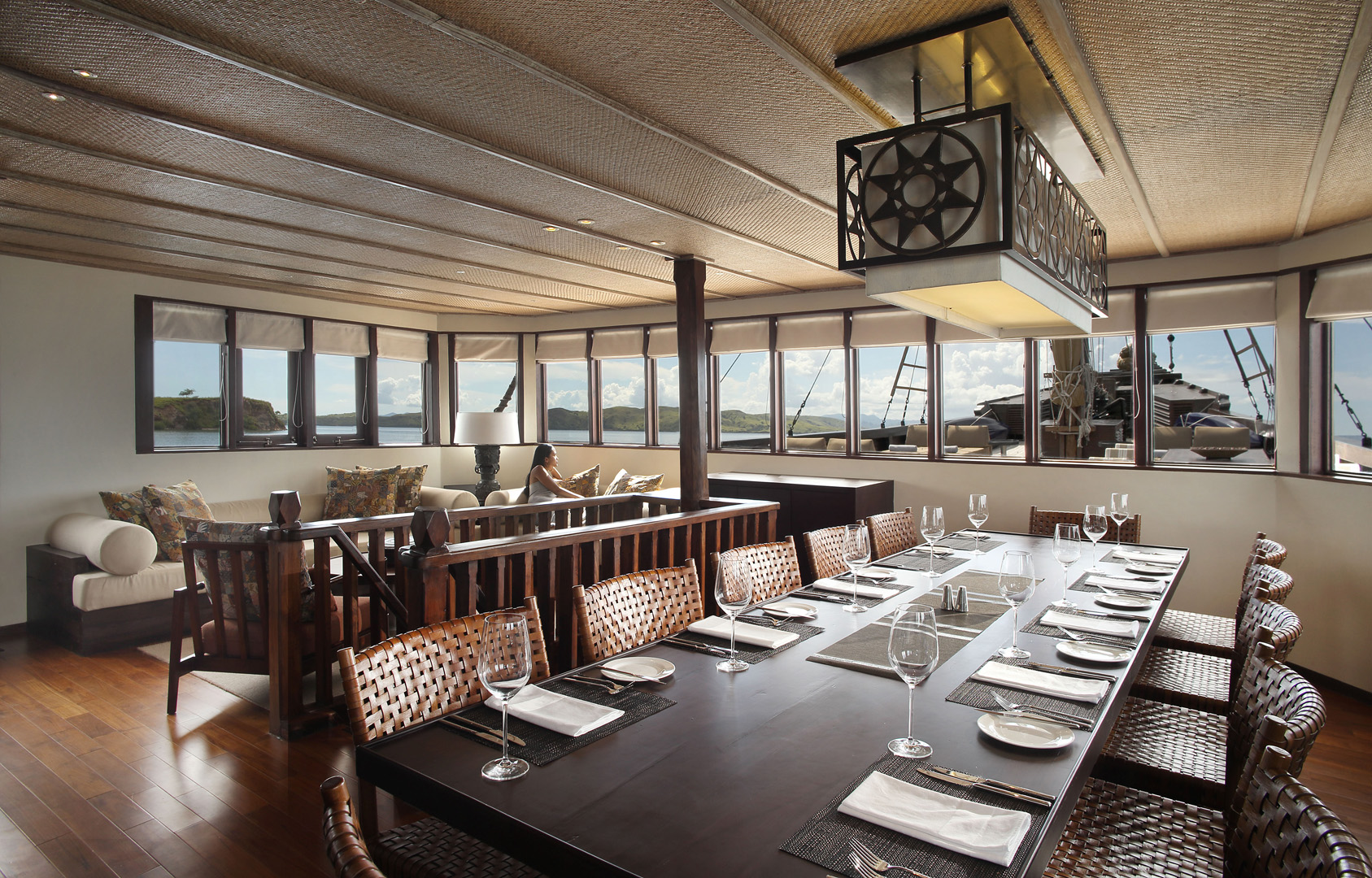 Alila Purnama main deck Majapahit lounge and indoor dining with panoramic windows over Komodo