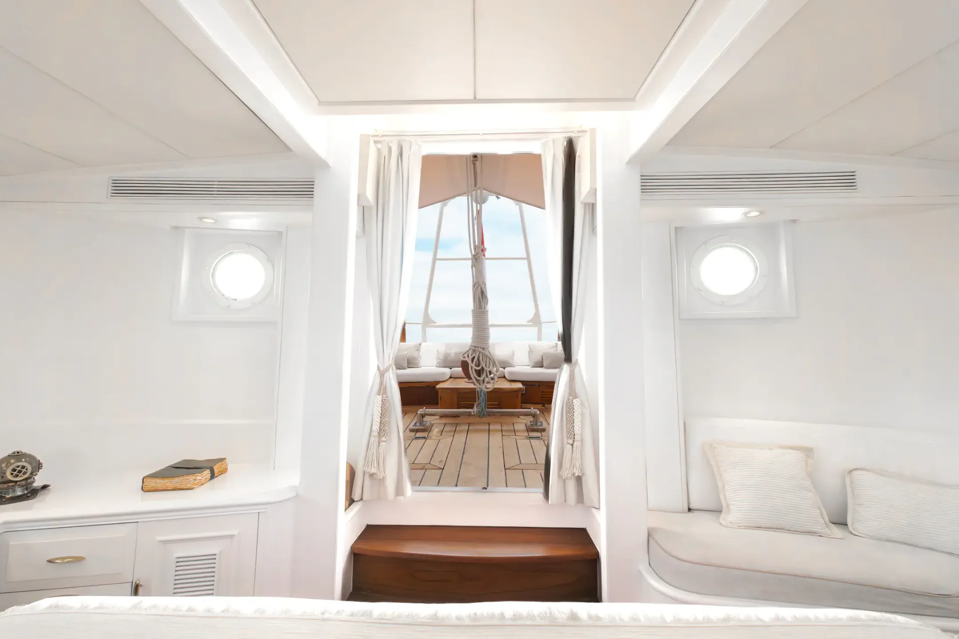 View from a Mutiara Laut cabin through curtained doorway onto the deck