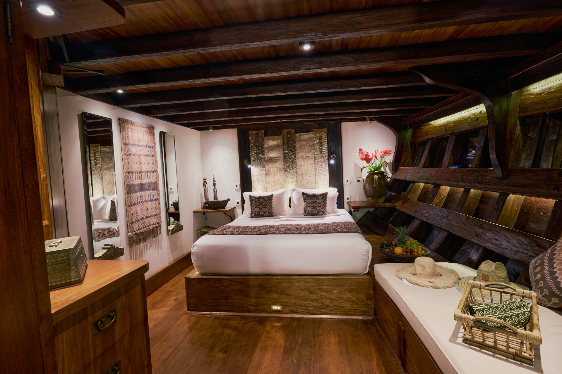 Celebes Suite on Si Datu Bua with king bed, Toraja textile panels and exposed ironwood ribs