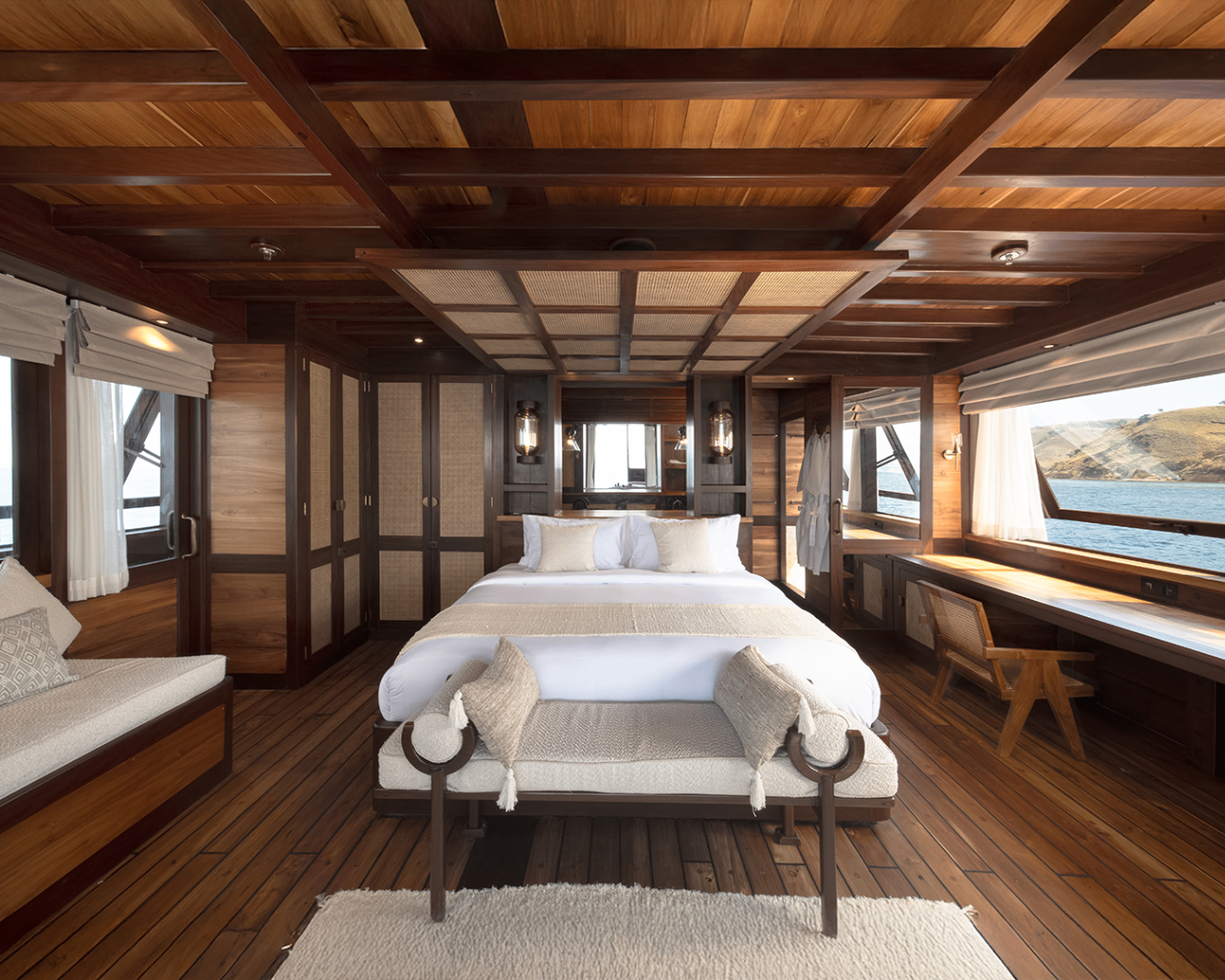 Owner's suite on Sanya with king bed, tall timber wardrobes and sea-facing windows