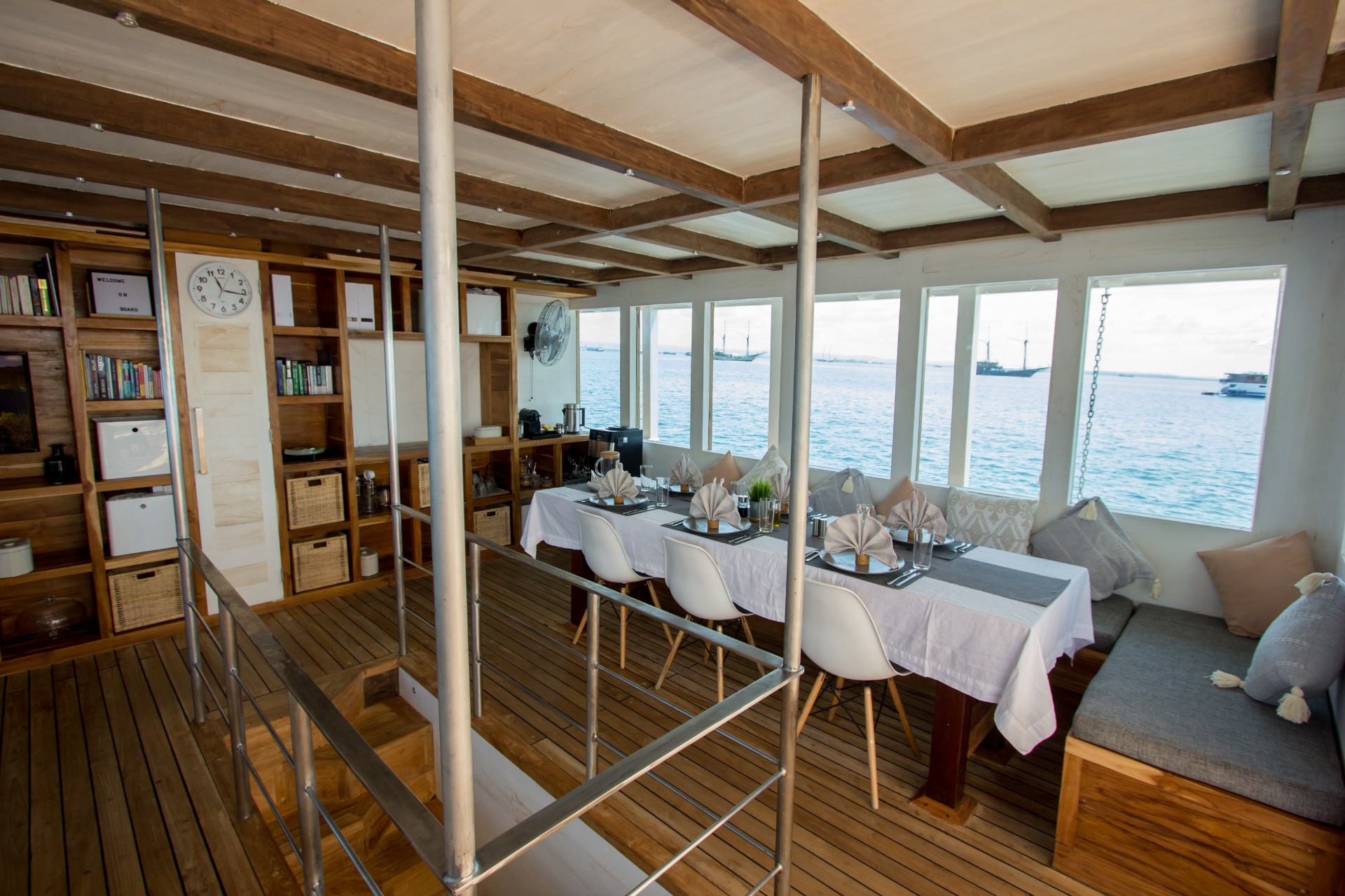Indoor dining area on Fenides with panoramic sea-view windows