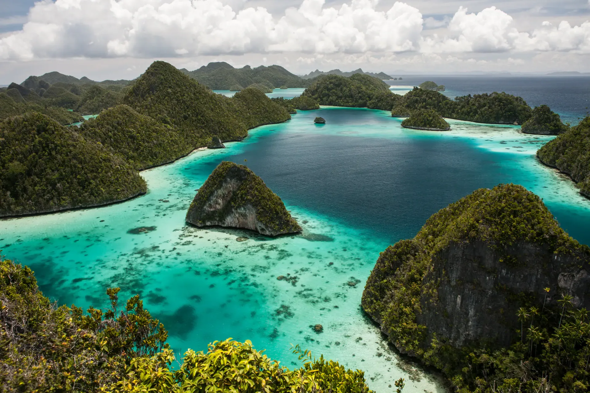Aerial view of Wayag's karst islands and turquoise lagoons in Raja Ampat